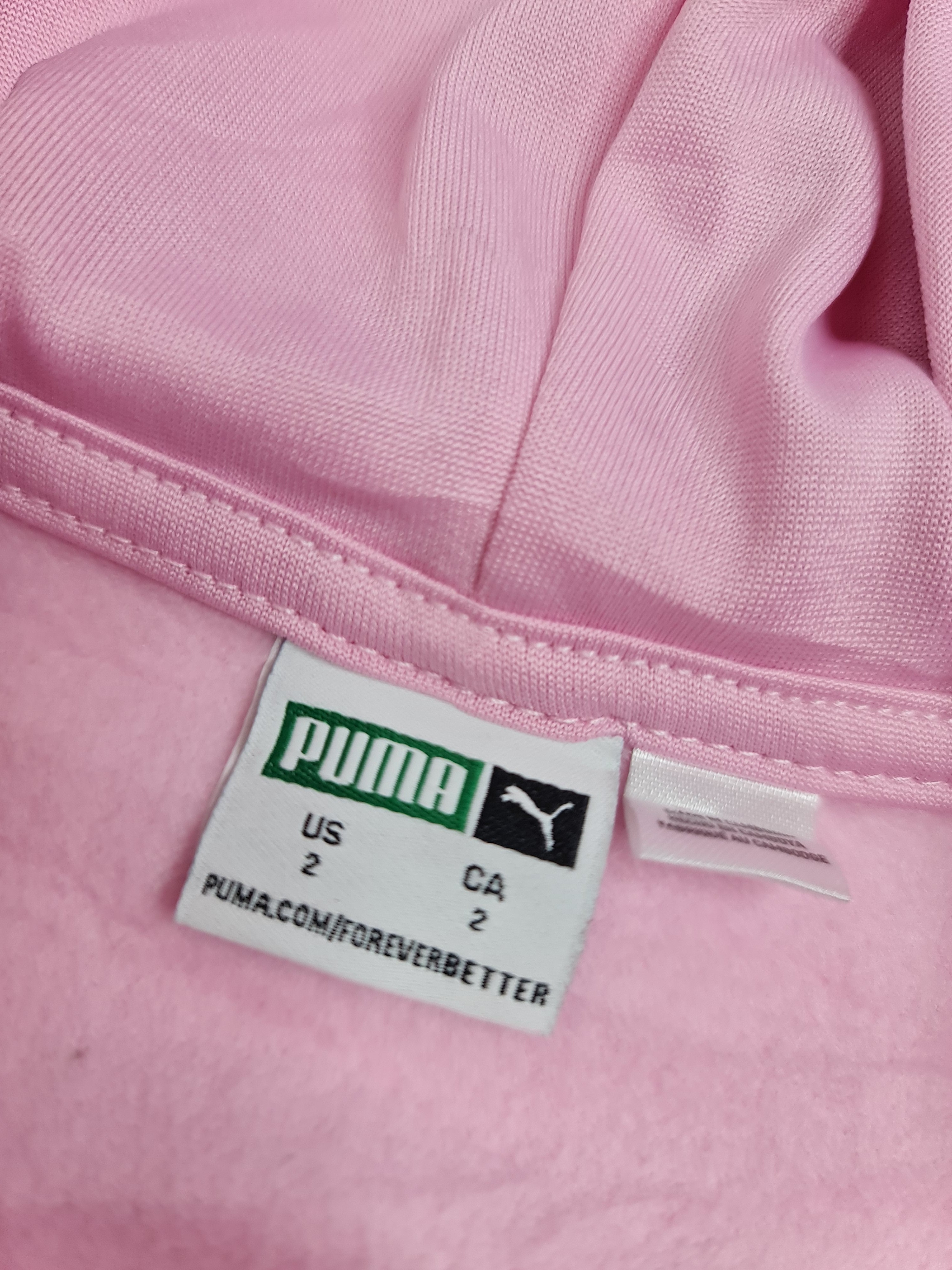 Suéter rosa de niña, marca Puma talla 2 años.