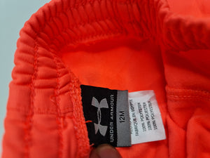 Pantalones naranjas, marca Under Armour, talla 12 meses