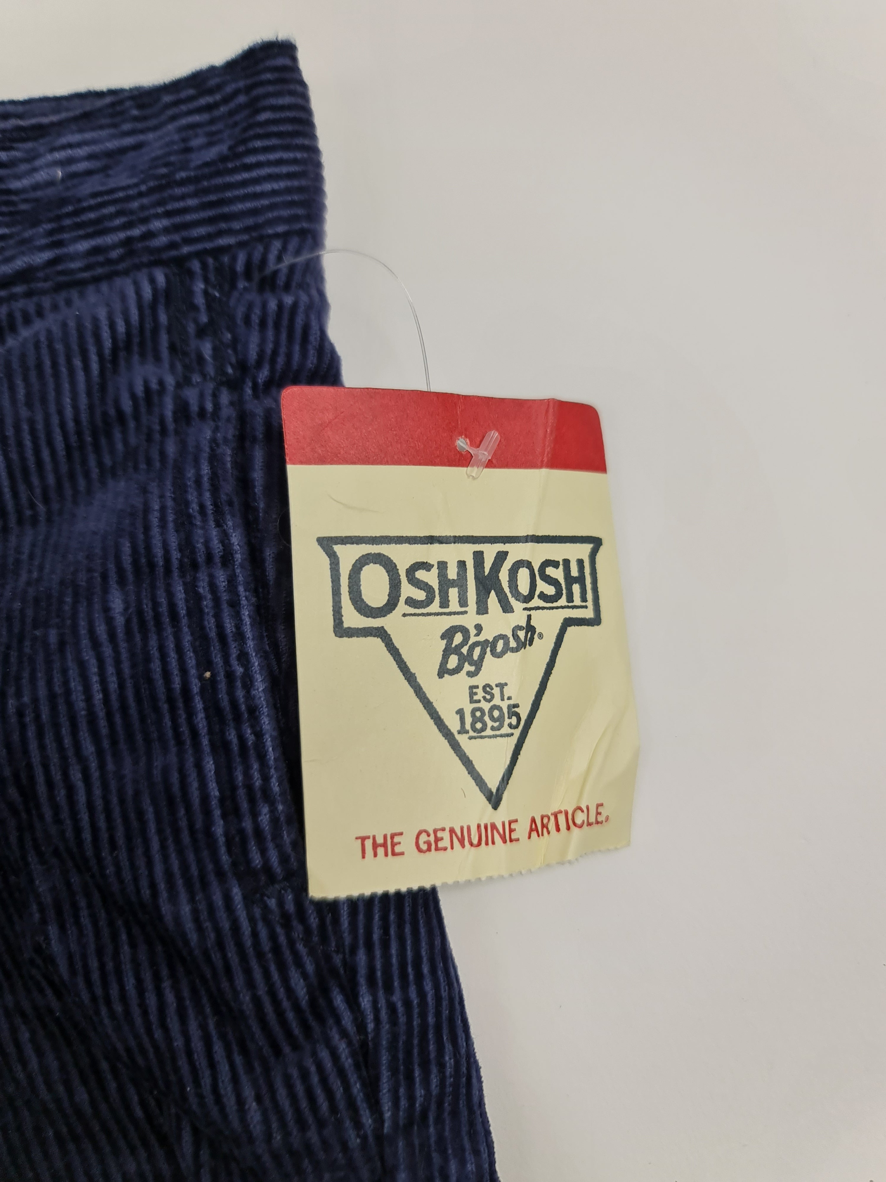Pantalones de mezclilla azul oscuro marca OshKosh, para bebé de 6 meses.